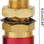 A close-up photo of a brass quick connector with a red hose end. The connector is silver colored